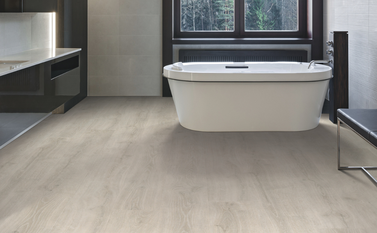 Laminate flooring in a bathroom with freestanding tub