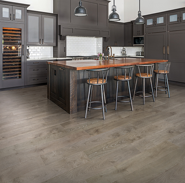 medium brown wood-look laminate flooring in a brown modern kitchen