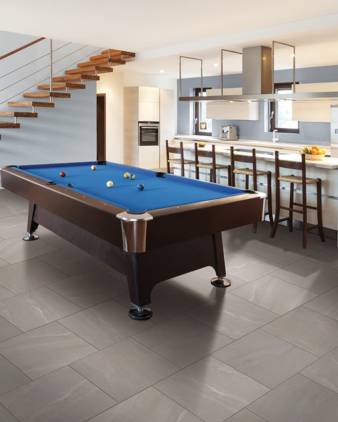basement recreation space with tile flooring, a pool table and kitchen