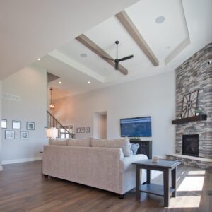 living room with floor to ceiling stone fireplace and hickory hardwood floors