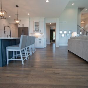 Cool blues, welcoming whites, and hickory hardwood floor