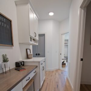 built in home office located in hallway of home, across from guest bathroom