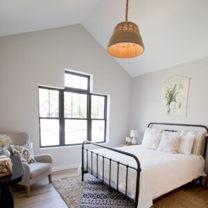 Bedroom with vaulted ceilings and hardwood floors