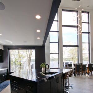 kitchen island accented with black vinyl flooring border