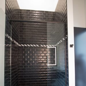 floor to ceiling shower with reverse bevel tile
