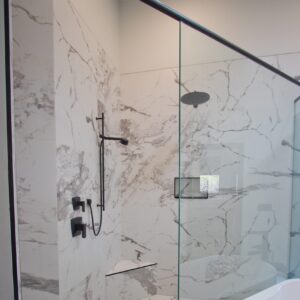 shower with large format marble attache tile