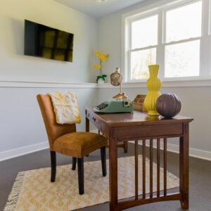 warm transitional home office with carpet