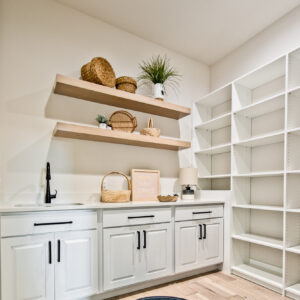 classic contemporary white pantry cabinets with oak wood floors