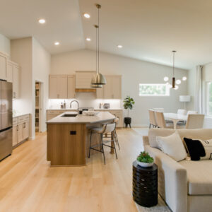 neutral tone kitchen and dining room with wood look floors