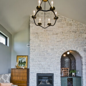 transitional french tudor sunroom with wet bar