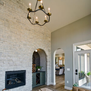 transitional french tudor sitting room with wet bar design