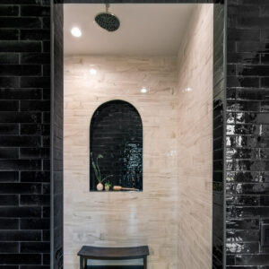 2x9 Ragno Tile in Nero, glossy with 4x12 ivory marble tile