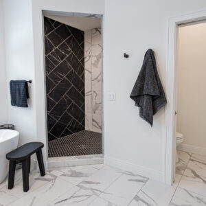 Transitonal Boho primary bathroom floor by msi, eden statuary 12x24 white