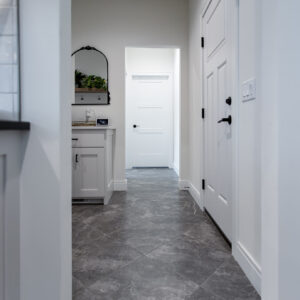 Transitonal Boho laundry room floors made from a stone-look ceramic tile