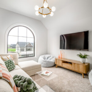 tween boho media room design with textured neutrals and warm accents