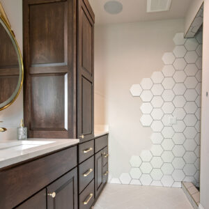 chic geometric modern primary bathroom with herringbone tile floor