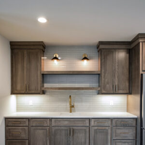 Classic Elegance Design, A modern coffee nook designed for relaxation and function—medium stained wood cabinets complement the sleek white quartz countertop, while white fluted wall tile adds texture and sophistication.