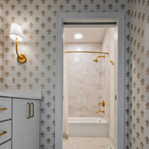 Classic Elegance Design, Stylish bathroom with a white double vanity and white quartz top, complemented by 8-inch marbled white hexagon floor tiles and Ragno Melange Collection Blanco tiles on the shower walls
