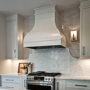 Classic Elegance kitchen design featuring a natural stained island with white quartz countertop and engineered hardwood flooring, replicable with products available at Coyle Carpet One Floor and Home in Madison, WI