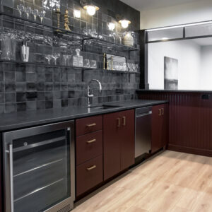 modern transitional elegance Home bar featuring black 4x4 tile backsplash and LVP flooring from Casabella Carolina Coastal collection in South Khaki-Lackey, offering a sleek and modern design with durable materials.