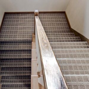 modern transitional elegance Staircase featuring brown and beige carpet with white plaid lines, offering a stylish and cozy touch to the home
