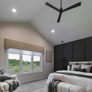 The primary bedroom is enhanced with Dreamweaver Mykonos carpet in Serene, offering a soft, plush feel and a neutral tone for a comfortable and serene retreat.