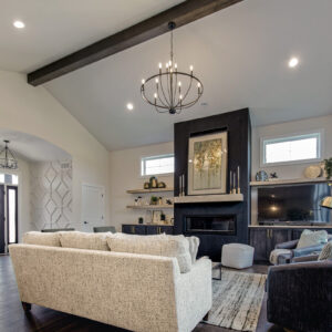 This inviting living room showcases the rich beauty of Paramount Streamside Hickory wood floors, adding warmth and elegance to the space with its natural tones and timeless appeal.